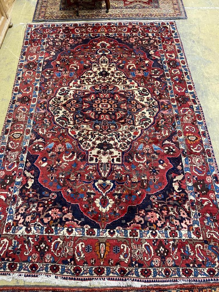 A Heriz style red ground carpet, 310 x 210cm